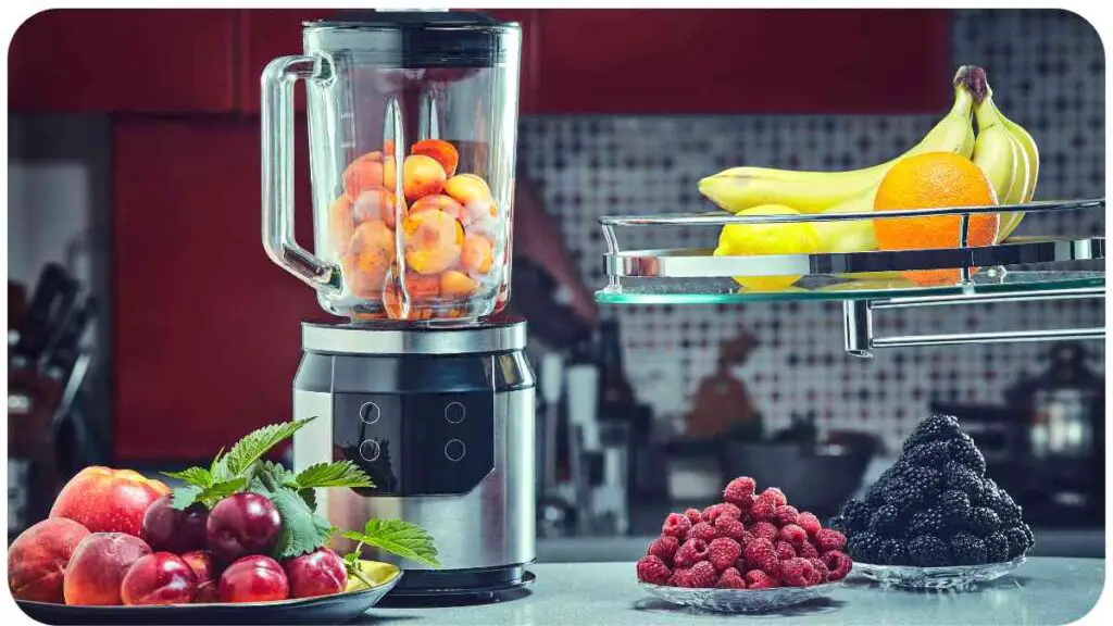 a blender sitting on a counter next to a bowl of fruit